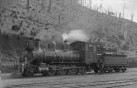 Francis standing at the rear of the engine by the cabin. Photo - Godber Collection, Alexander Turnbull Library